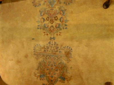 Lot 718 - Kirman Carpet The central polychrome pendant...