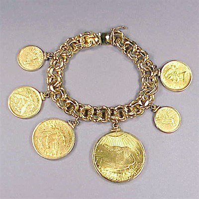 Lot 379A - Gold Charm Bracelet 14 kt. yellow gold, the...