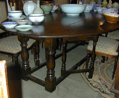 Lot 722 - Provincial George I Style Oak Gate-Leg Table