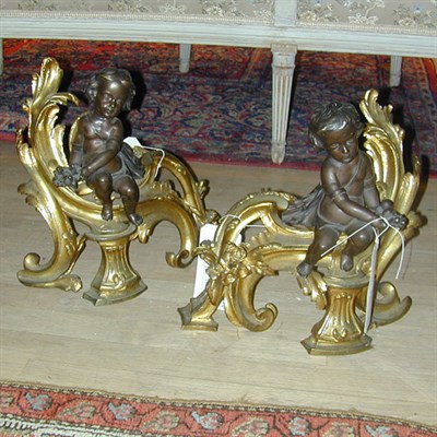 Lot 522 - Pair of Gilt and Patinated-Bronze Chenets Each...