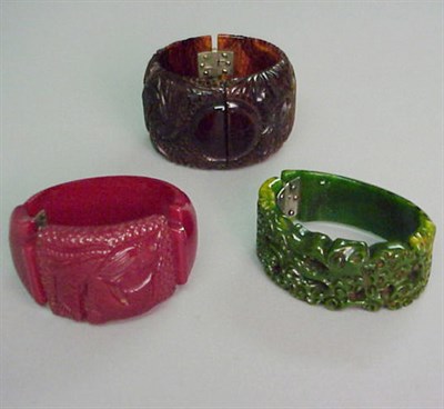Lot 372 - Group of Three Bakelite Hinged Bracelets Each...