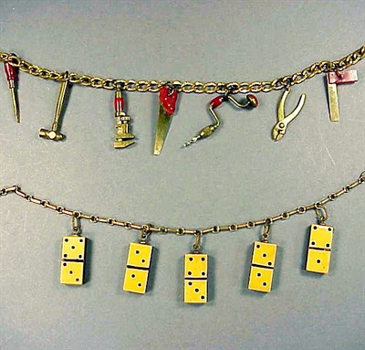 Lot 347 - Bakelite and Brass Necklace The chain...