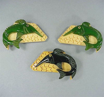 Lot 540 - Set of Three Bakelite Dress Clips Each...