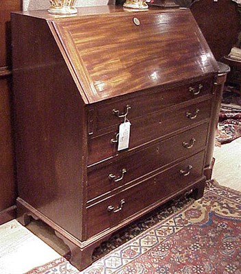 Lot 234 - George III Mahogany Bureau The rectangular top...