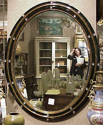 Lot 483 - Regency Style Gilt-Decorated Oval Mirror