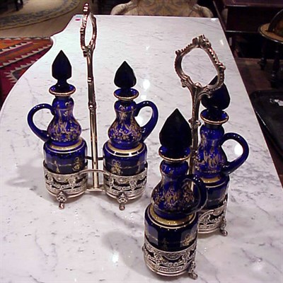 Lot 416 - Two Cobalt Glass and Silver Plated Cruet Sets