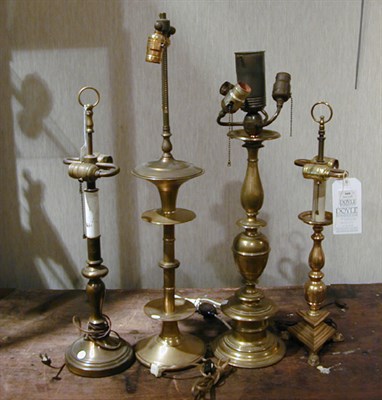 Lot 669 - Group of Four Brass Lamps