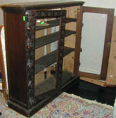 Lot 252 - Baroque Style Carved Oak Bookcase The two...