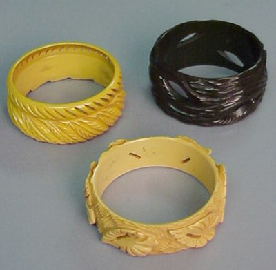 Lot 645 - Group of Three Bakelite Bracelets Each with...