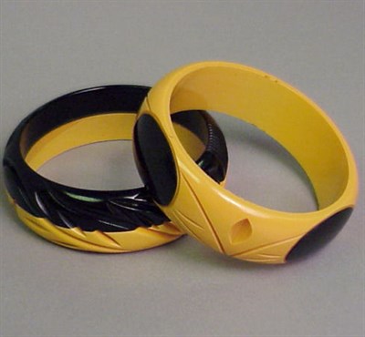 Lot 611 - Two Bakelite Two-Tone Laminate Bracelets Each...
