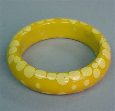 Lot 472 - Bakelite Random Dot Bracelet In yellow with...