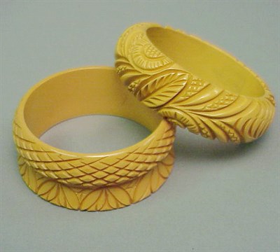 Lot 612 - Two Bakelite Bracelets Each in cream with...