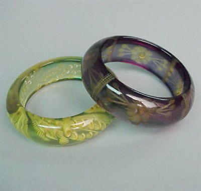 Lot 534 - Two Bakelite Reverse Carved Bracelets Wider 1...
