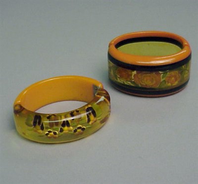 Lot 369 - Two Bakelite Reverse Carved and Painted Hinged...