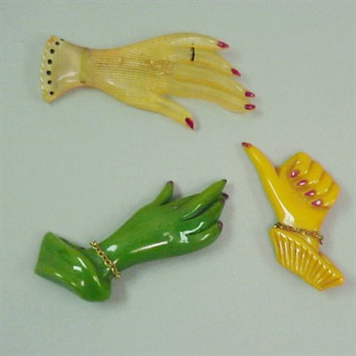 Lot 552 - Group of Three Bakelite Hand-Form Brooches...