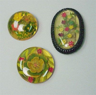 Lot 554 - Group of Three Bakelite Reverse Carved and...