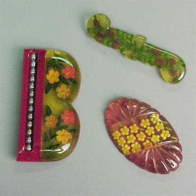 Lot 616 - Group of Three Bakelite Reverse Carved and...