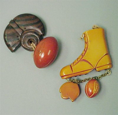 Lot 664 - Two Bakelite Brooches Each suspending various...