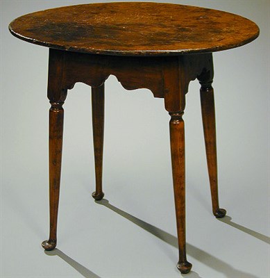 Lot 214 - Queen Anne Maple Tea Table The oval top above...