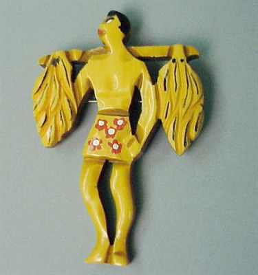 Lot 635 - Bakelite Brooch Depicting a native carrying...