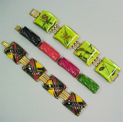Lot 668 - Group of Three Bakelite and Metal Bracelets...