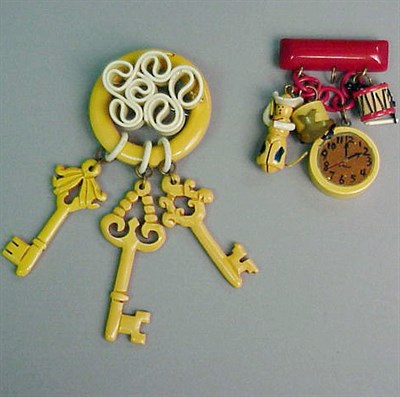 Lot 299 - Two Bakelite Broochs One suspending keys,...