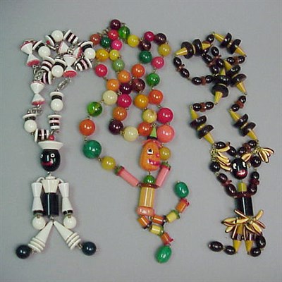 Lot 583 - Group of Three Molded Plastic Necklaces...