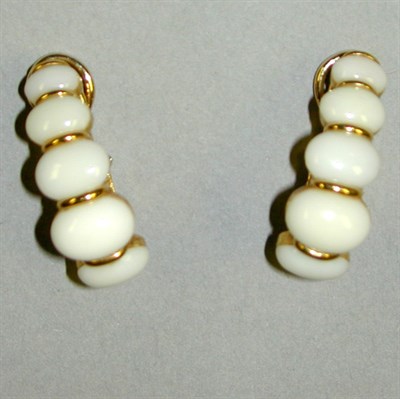 Lot 106 - Pair of Cabochon Coral Earrings 18 kt. yellow...