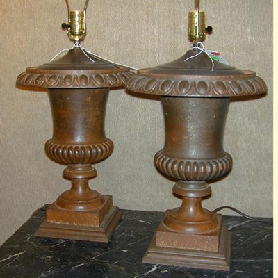 Lot 737 - Pair of Cast Iron Urns Each mounted as a lamp.