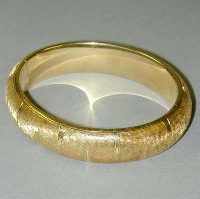Lot 299 - Gold Bangle Bracelet 14 kt. yellow gold, the...