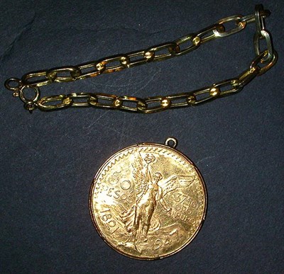 Lot 70 - Gold Coin and Bracelet The 14 kt. yellow gold...