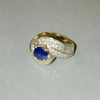 Lot 192 - Sapphire and Pave Diamond Ring 14 kt. yellow...
