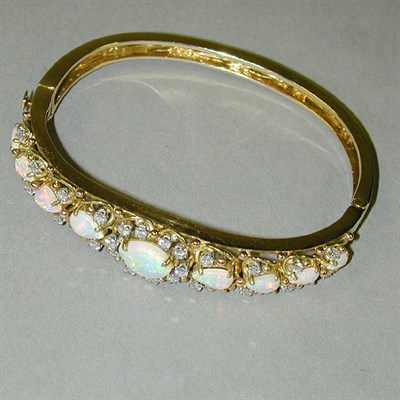 Lot 332 - Opal and Diamond Bracelet 14 kt. yellow gold,...