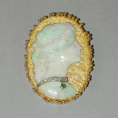 Lot 372 - Opal Cameo Pin The 18 kt. yellow gold frame...
