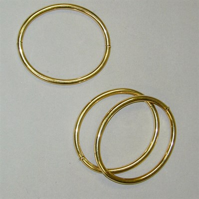Lot 123 - Three Gold Bangle Bracelets 14 kt. yellow gold,...