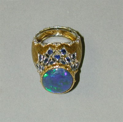 Lot 363 - Black Opal and Sapphire Ring 18 kt. white and...