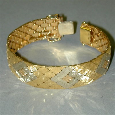 Lot 245 - Two-Tone Gold Flexible Bracelet 18 kt. yellow...