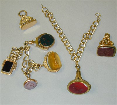Lot 80 - Two Seal Charm Bracelets 14 kt. and 9 kt....