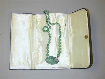 Lot 69 - Jade Bead Necklace The graduated jade bead...