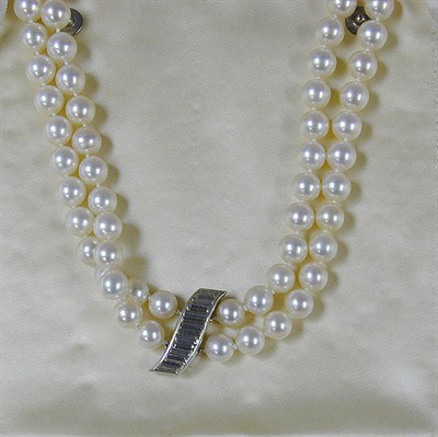 Lot 394 - Cultured Pearl Necklace with Diamond Clasp The...