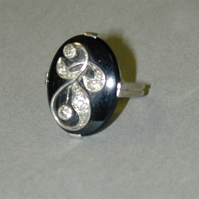 Lot 56 - Black Onyx and Diamond Ring 14 kt. white gold...
