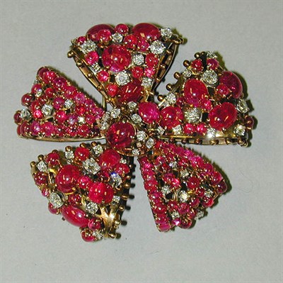 Lot 343 - Cabochon Ruby and Diamond Flower Brooch 14 kt....
