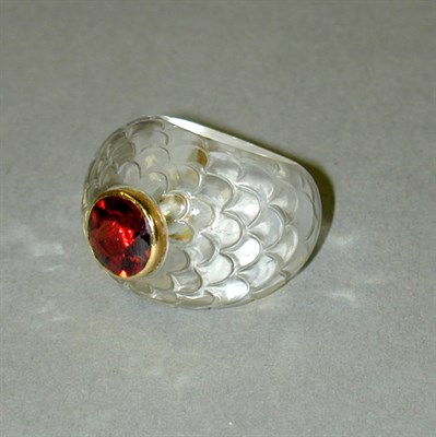 Lot 68 - Carved Rock Crystal Ring The carved top of...