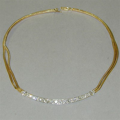 Lot 407 - Gold and Diamond Necklace The 18 kt. yellow...