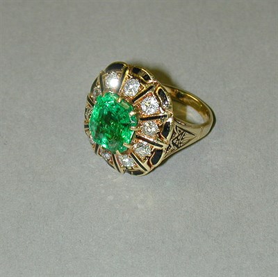Lot 299 - Emerald and Diamond Cluster Ring 14 kt. yellow...