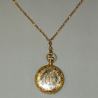 Lot 49 - Lady's Lapel Watch and Chain 14 kt. yellow...