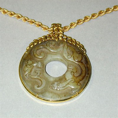 Lot 163 - Gold and Nephrite Pendant The 14 kt. yellow...