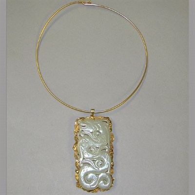 Lot 133 - Gold Torque and Nephrite Pin/Pendant The 14 kt....