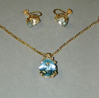 Lot 96 - Blue Topaz Pendant and Pair of Earrings 14 kt....