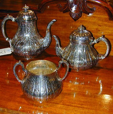Lot 504 - Sterling Silver Three-Piece Tea and Coffee...